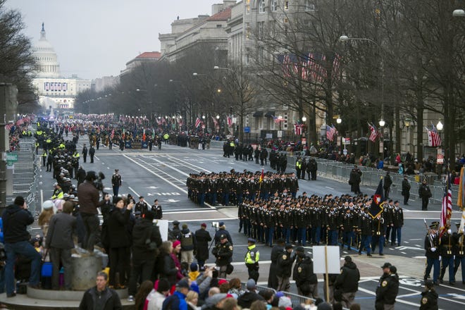 In this Jan. 20, 2017, photo, military units participate in the inaugural parade from the Capitol to the White House in Washington. [AP Photo/Cliff Owen, File]