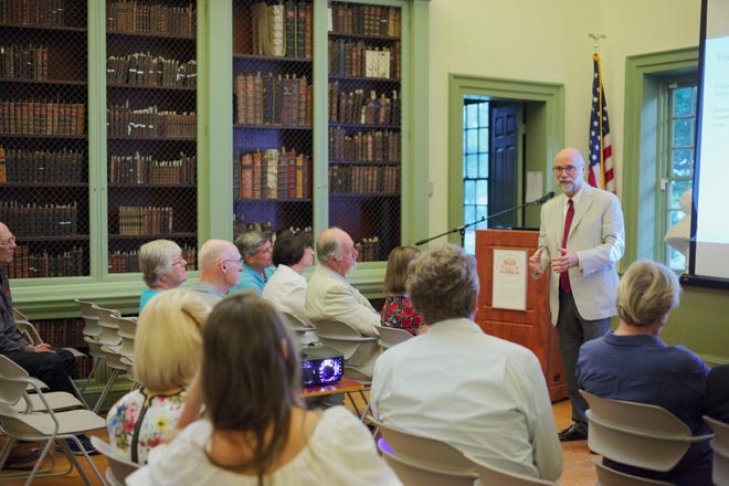 Architecture professor Steve W. Semes answers a question from an audience member after his talk, titled, 'New Buildings in Historic Places: Preservation from an International Perspective,' on Thursday at the Redwood Library Athenaeum in Newport. [PETER SILVIA PHOTO]