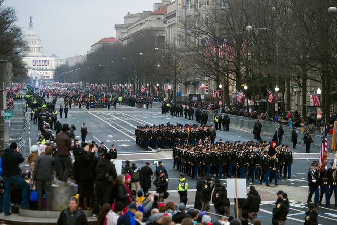 In this Jan. 20, 2017, file photo, military units participate in the inaugural parade from the Capitol to the White House in Washington, Friday, Jan. 20, 2017. A U.S. official says the 2018 Veterans Day military parade ordered up by President Donald Trump would cost about $92 million _ more than three times the maximum initial estimate. (AP Photo/Cliff Owen, File)