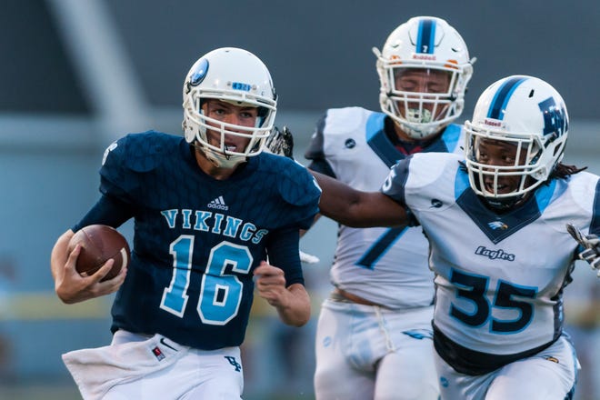 Union Pines Vikings quarterback Rory Board (16) finds running room on the outside during a game between the Union Pines Vikings and the East Montgomery Eagles, at Woodrow Wilhoit Stadium, Aug. 18, 2017, in Cameron, N.C. The Vikings fell to the Eagles, 35-21. (Timothy L. Hale/Special to The Pilot)