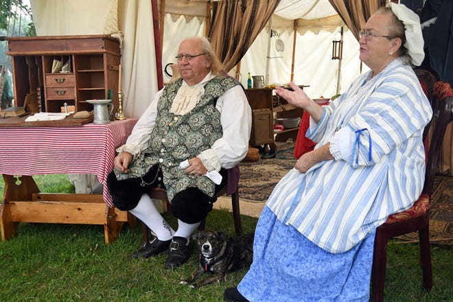 "Benjamin Franklin" and his wife "Deborah Read" chat with people as they pass by during Galesburg Heritage Days Rendezvous at Lake Storey Saturday afternoon. [BILL NICE/The Register-Mail]