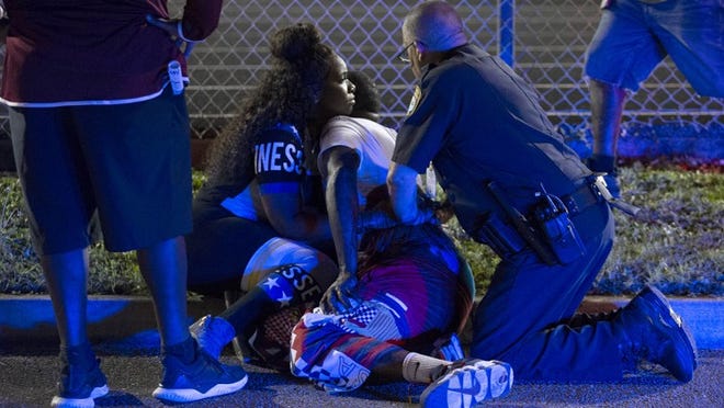 Pressure being applied to wounded person at game in Wellington, Florida on August 17, 2018.