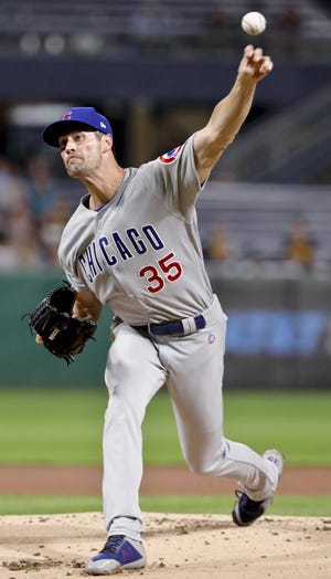 Chicago Cubs starter Cole Hamels pitches to a Pittsburgh Pirates batter during the first inning of the game, Friday, Aug. 17, 2018, in Pittsburgh. [KEITH SRAKOCIC/THE ASSOCIATED PRESS]