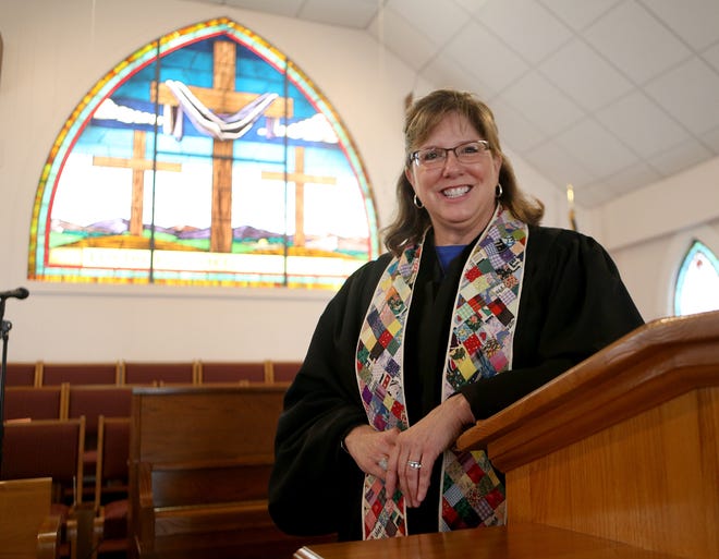 The Rev. Lisa Martin stands for a photo Tuesday at First Presbyterian Church of Lynn Haven. [PATTI BLAKE/THE NEWS HERALD]