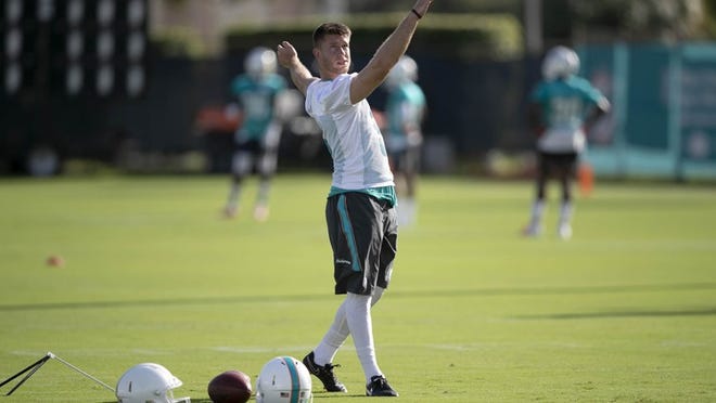 Miami Dolphins kicker Greg Joseph follows through on a practice kick at training camp.