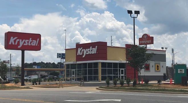 The new 1,788 square-foot Tuscaloosa Krystal restaurant features a full-glass front, a wood-framed open ceiling in the dining room and a color package that includes crimson red in a nod to the University of Alabama. The building is square, like Krystal's signature burgers. [Staff photo/Stephanie Taylor]