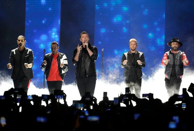 FILE - In this June 6, 2018 file photo, Kevin Richardson, Howie Dorough, Nick Carter, Brian Littrell, and AJ McLean of Backstreet Boys, perform "Don't go Breaking My Heart" at the CMT Music Awards at the Bridgestone Arena in Nashville, Tenn. Over a dozen people were injured, Saturday, Aug. 18 and transported to hospitals after trusses holding up the entrance to a resort where the Backstreet Boys were set to begin a concert in Oklahoma collapsed. (AP Photo/Mark Humphrey, File)
