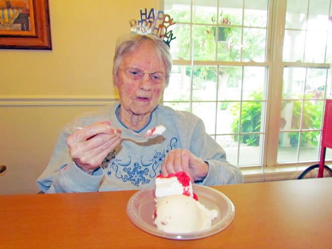 Ruby Berry of Drews Place, enjoying her 102nd birthday cake.