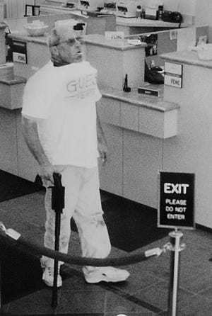 Brian Wells is seen inside the PNC bank in Summit Towne Centre on Aug. 28, 2003, in a FBI handout from surveillance images shot during the bank robbery. [FBI]