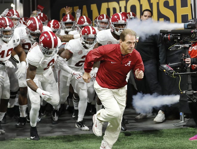 FILE - In this Jan. 8, 2018, file photo, Alabama head coach Nick Saban leads his team on the field before the college football playoff championship game against Georgia, in Atlanta in January. The AP preseason Top 25 is out, and for the third straight year Alabama is No. 1. [File photo / The Associated Press]
