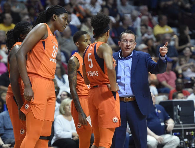 Connecticut coach Curt Miller talks to Jasmine Thomas (5), Jonquel Jones (35) and Courtney Williams (rear) during a break in the action in the Sun’s 89-86 win over Los Angeles Sunday at Mohegan Sun Arena. (Khoi Ton/Mohegan Sun Arena)