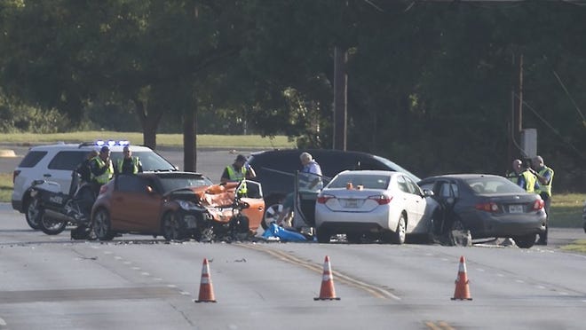 Austin police investigate the scene of a three-vehicle crash on Pleasant Valley Road on Tuesday morning. One man was killed and two women were taken to the hospital, medics said. RALPH BARRERA / AMERICAN-STATESMAN