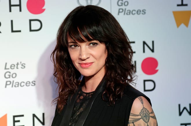 FILE - In this April 12, 2018 file photo, Italian actress and director Asia Argento arrives at the ninth annual Women in the World Summit in New York. Argento, one of the most prominent activists of the #MeToo movement against sexual harassment, recently settled a complaint filed against her by a young actor and musician who said she sexually assaulted him when he was 17, the New York Times reported. (AP Photo/Frank Franklin II, File)