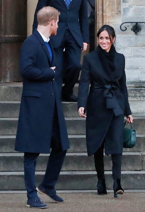 FILE - In this Thursday, Jan.18, 2018 file photo, Britain's Prince Harry and his fiancee Meghan Markle leave after a visit to Cardiff Castle in Cardiff, Wales. When Meghan wore jeans from the Hiut Denim Company, there was worldwide publicity about a firm in Wales which started to re-employ workers displaced when the local factory closed, helping small companies like Hiut buck the globalization trend. (AP Photo/Frank Augstein, FILE)