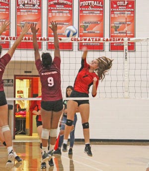 Coldwater's Abby Herman blasts a kill versus Kalamazoo Central Wednesday.