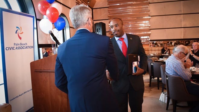Ned Barnes greets Senate candidate Bobby Powell at the Palm Beach Civic Association’s Primary Election Meet and Greet Event at Meat Market, Palm Beach, August 20,2018. (Melanie Bell / Daily News)