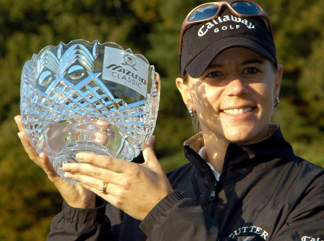 Annika Sorenstam holds a victory trophy during an awarding ceremony of the Mizuno Classic at Seta Golf Course in Otsu, western Japan Sunday, Nov. 10, 2002. As part of The First Tee, she will play six holes with a host of young golfers, including two from Bolivia. (AP Photo/Katsumi Kasahara)