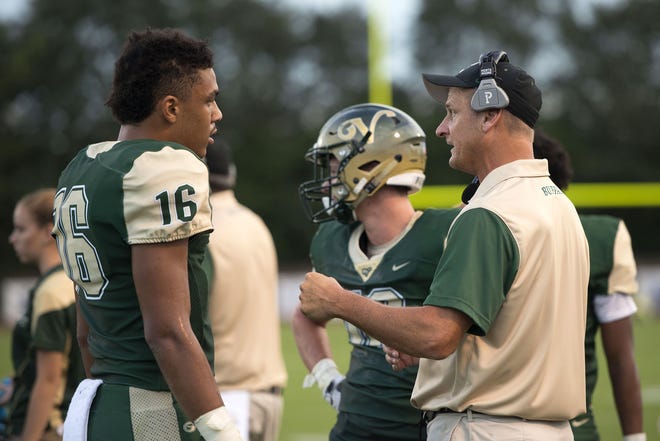The Villages coach Richard Pettus talks to his team during a game. [CINDY SHARP/CORRESPONDENT]