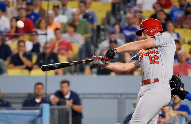 St. Louis Cardinals' Paul DeJong hits a two-run home run during the ninth inning of a baseball game against the Los Angeles Dodgers on Wednesday, Aug. 22, 2018, in Los Angeles. (AP Photo/Mark J. Terrill)