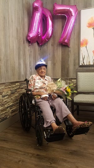 Lorraine Tillmon celebrates her 107th birthday on Aug 23, 2018 at Village Green & Rehab. [Photo by Nikki Baldwin]