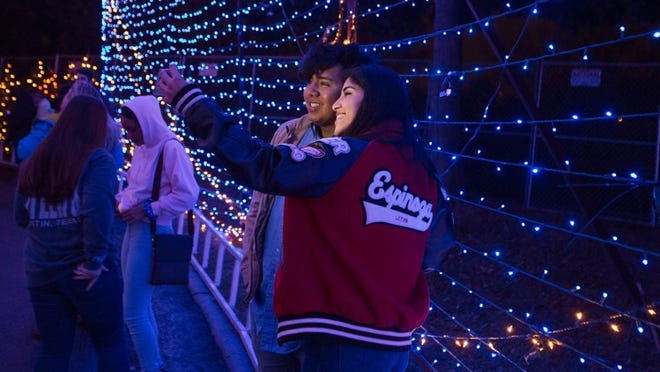 Sarah Espinoza and Santiago Jimenez take a selfie on the Trail of lights in 2016. The Trail returns Dec. 10. Dave Creaney/AMERICAN-STATESMAN.
