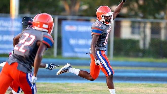 Palm Beach Gardens #83 Clifton Michel celebrates his touchdown against Glades Central during the first half at Palm Beach Gardens High School on August 17, 2018. (Photo Contributed by Colin Graulich)