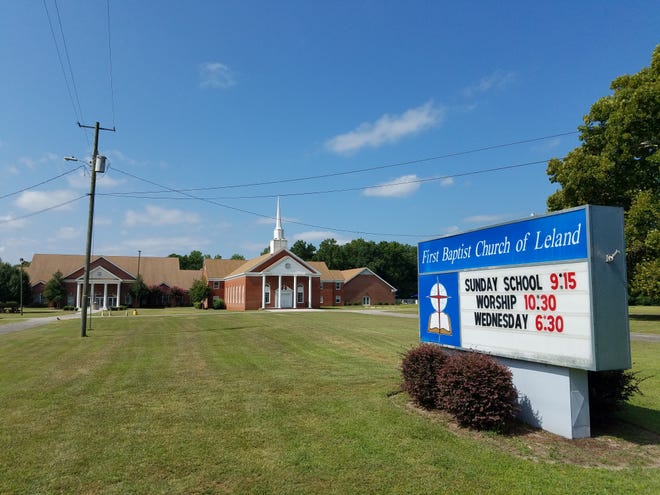 Leland has fined First Baptist Church $1,500 over the church's sign along Village Road, which the town says violates its sign ordinance. [GARETH McGRATH/STARNEWS]