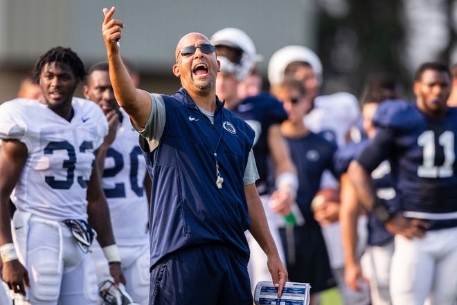 Penn State head coach James Franklin yells during an NCAA college football practice, Wednesday, Aug. 15, 2018, in State College, Pa. (Joe Hermitt/The Patriot-News via AP)