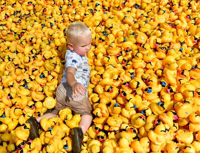 FRED ZWICKY/JOURNAL STAR

Jude Burt, 1, of Pekin decides to swim in the ducks after 30,000 rubber ducks raced down a giant 750-foot water slide for the 30th annual Duck Race at EastSide Centre to benefit the Center for Prevention of Abuse. The event raised $155,000 to benefit the center and its mission of helping women, men, and children live free from violence and abuse in central Illinois.