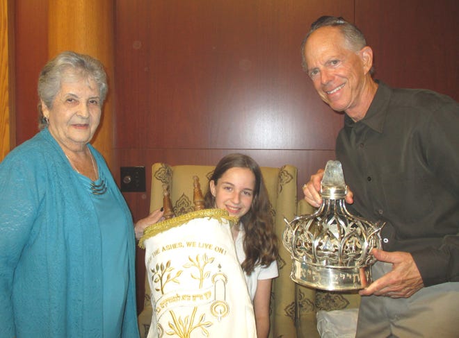 One of the Torah scrolls dressed in “holiday whites” at last year’s Selichot ceremony is shown. Temple Emanu-El, 151 McIntosh Road, Sarasota, will inaugurate the Jewish High Holy Day season with Selichot services Sept. 1. A dessert reception begins at 7:30 p.m., and the changing of the Torah mantles and Selichot service begin at 8 p.m. For more information, please call 941-371-2788. [PROVIDED PHOTO]