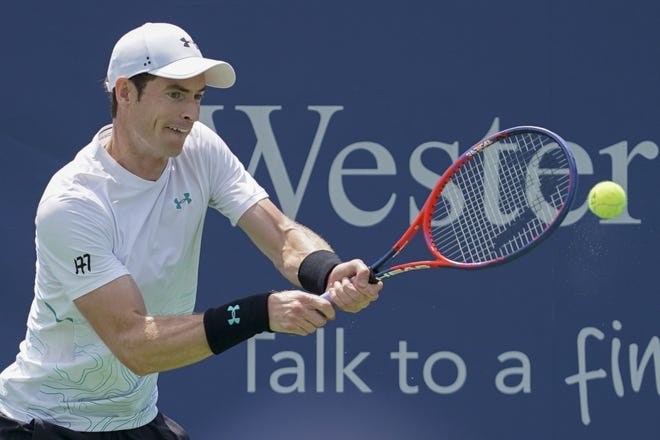 Andy Murray returns a shot to Lucas Pouilleat the Western & Southern Open last week in Mason, Ohio. Murray is back in the U.S. Open this week after sitting out last year with injuries. [Photo by AP]