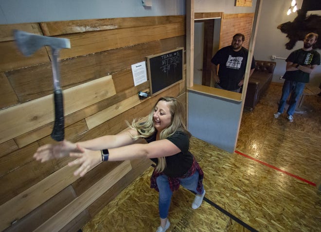 Courtney Strouse throws an axe at Oregon Axe, a new axe throwing business located in Springfield Ore. [Ben Lonergan/The Register Guard] - registerguard.com