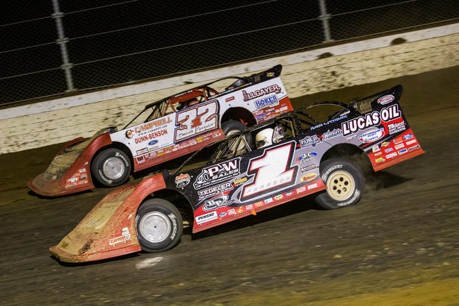 Earl Pearson Jr. (1) battles Bobby Pierce for the lead Saturday night at Mansfield Motor Speedway in the Dirt Million. Pearson earned almost $203,000 for the win while Pierce had to settle for a $40,588 runner-up purse. [Heath Lawson photo]