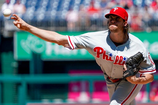 Philadelphia Phillies starting pitcher Aaron Nola throws during the first inning of a baseball game against the Washington Nationals at Nationals Park, Thursday, Aug. 23, 2018, in Washington. (AP Photo/Andrew Harnik)