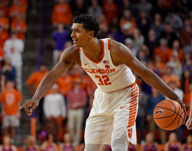 Clemson's Donte Grantham looks to pass during the second half of an NCAA college basketball game against Miami Saturday, Jan. 13, 2018, in Clemson, S.C. Clemson won 72-63. (AP Photo/Richard Shiro)