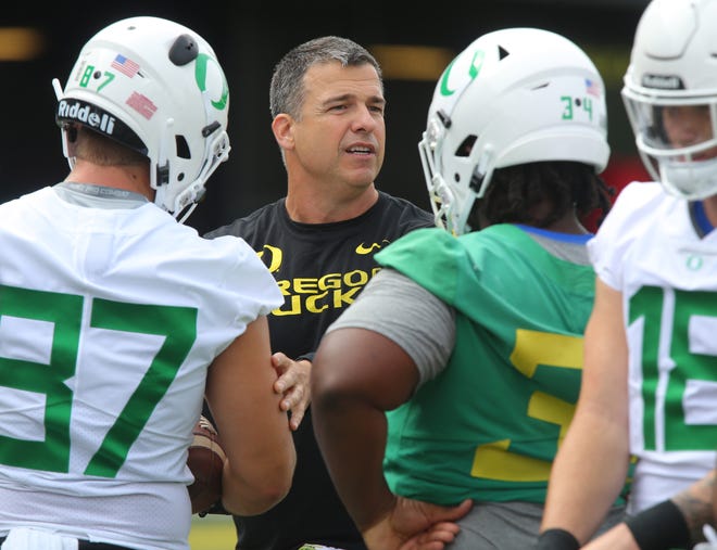 Oregon head coach Mario Cristobal runs the players through drills at the start of fall camp at the Hatfield-Dowlin Complex in Eugene, Ore. Friday, August 3, 2018. [Brian Davies/The Register-Guard] - registerguard.com