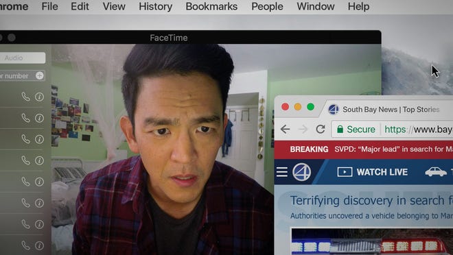 David Kim (John Cho) is overwhelmed by computer images while trying to find his missing daughter. [Screen Gems]