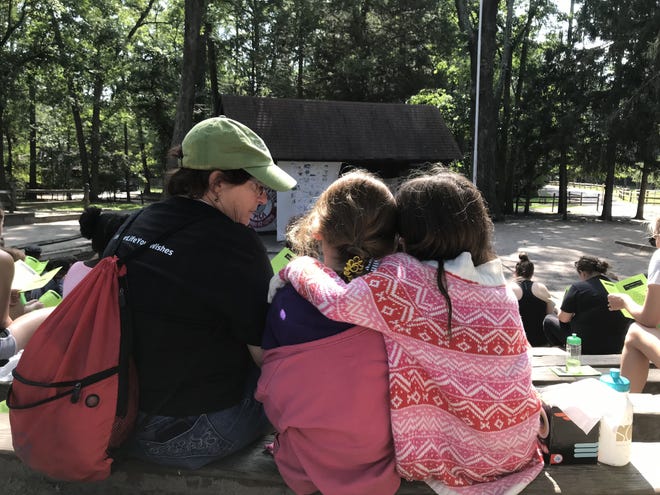 At Camp Firefly, kids who have experienced the loss of a loved one learn coping skills and spend the weekend supporting each other. [LISA RYAN / STAFF PHOTOJOURNALIST]