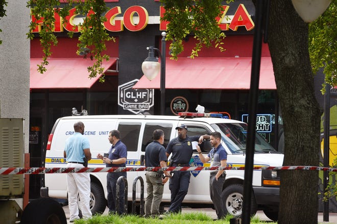 Monday, officers continued to investigate Sunday's mass shooting at The Jacksonville Landing. [Bob Self/Florida Times-Union]