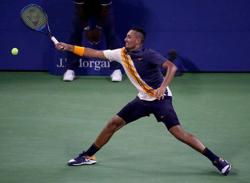 Nick Kyrgios, of Australia, chases a shot from Radu Albot, of Moldova, during the first round of the U.S. Open tennis tournament, Tuesday, Aug. 28, 2018, in New York. (AP Photo/Julio Cortez)