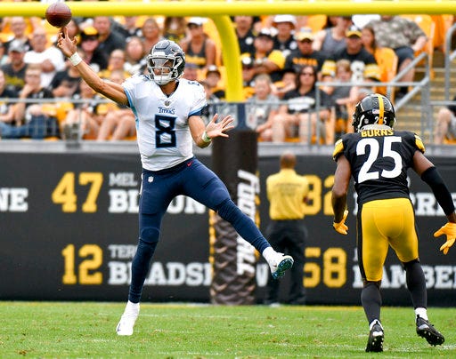 File-This Aug. 25, 2018, file photo shows Tennessee Titans quarterback Marcus Mariota (8) getting a pass away as Pittsburgh Steelers cornerback Artie Burns (25) rushes him in the first half of an NFL preseason football game, in Pittsburgh. Mariota’s emergence as one of the NFL’s top young stars helped provide proof that a good quarterback can be found in the state of Hawaii. (AP Photo/Don Wright, File)