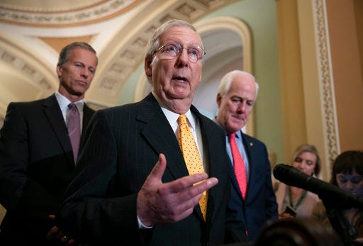 Senate Majority Leader Mitch McConnell, R-Ky., joined by Sen. John Thune, R-S.D., left, and Majority Whip John Cornyn, R-Texas, speaks with reporters following their weekly policy meetings, at the Capitol in Washington, Tuesday, Aug. 28, 2018. (AP Photo/J. Scott Applewhite)