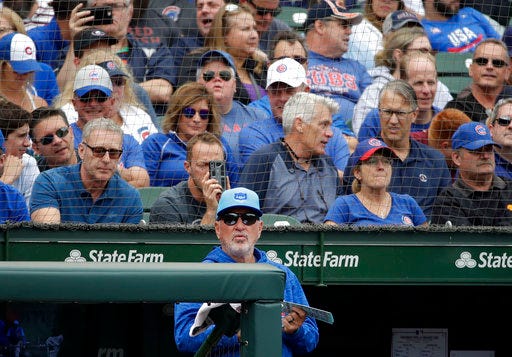 Chicago Cubs manager Joe Maddon watches his team during the fifth inning of a baseball game against the Cincinnati Reds, Friday, Aug. 24, 2018, in Chicago. The Cubs keep winning through everything that knocks some contenders out of the playoff race. Credit one of the majors’ deepest rosters, but manager Joe Maddon also is pushing all the right buttons as Chicago tries to close out its third consecutive NL Central title. (AP Photo/Nam Y. Huh)