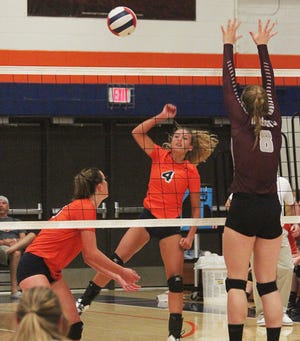Pontiac’s Madison Wright launches an attack against Illinois Valley Central Monday at PTHS. Wright had 14 kills in the Tribe’s match victory.