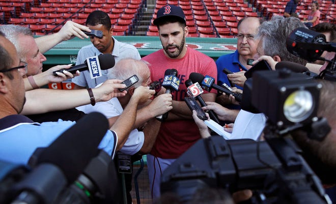 The Red Sox' J.D. Martinez is surrounded by reporters on Tuesday as he discusses a social media post he made in 2013.