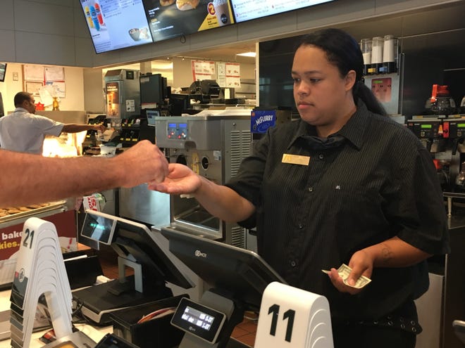 Shift Manager Tiffany Nichols takes an order from a customer at the McDonalds in Mount Holly. [KELLY KULTYS / STAFF PHOTOJOURNALIST]
