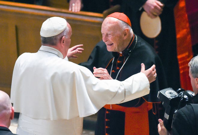 FILE PHOTO - In this Sept. 23, 2015 file photo, Pope Francis reaches out to hug Cardinal Archbishop emeritus Theodore McCarrick after the Midday Prayer of the Divine with more than 300 U.S. Bishops at the Cathedral of St. Matthew the Apostle in Washington. Seton Hall University has begun an investigation into potential sexual abuse at two seminaries it hosts following misconduct allegations against ex-Cardinal McCarrick and other priests.