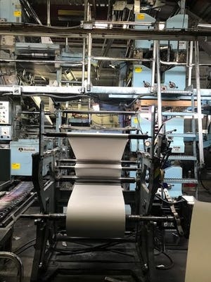 Newsprint is seen on rolls on the presses at the Messenger Post Media office in Canandaigua. [JENNIFER REED/MESSENGER POST MEDIA FILE PHOTO]