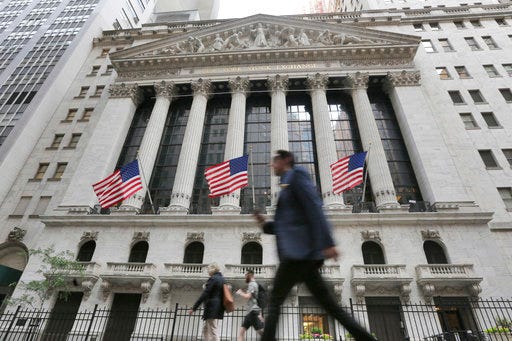 FILE - In this June 24, 2016, file photo, people walk by the New York Stock Exchange. The U.S. stock market opens at 9:30 a.m. EDT on Wednesday, Aug. 29. 2018. (AP Photo/Richard Drew, File)