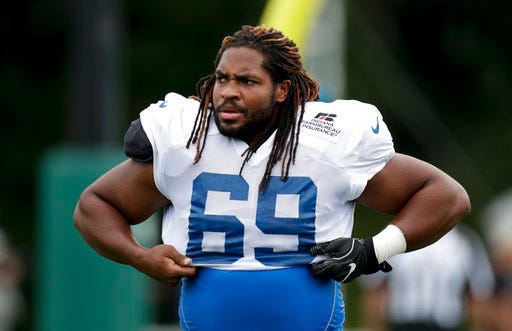 FILE - In this Aug. 17, 2018, file photo, Indianapolis Colts' Deyshawn Bond (69) warms up during a joint practice with the Baltimore Ravens at the Colts NFL football training camp in Westfield, Ind. Bond remembers camping out inside a cramped hotel room late last summer. There he reveled in the sound of silence because he knew he probably made the team as an undrafted rookie. But in those first 24 hours Bond learned some lessons about dealing with the angst of cutdown weekend. And now he’s providing advice to teammates who find themselves in the same position this year.(AP Photo/Michael Conroy, File)